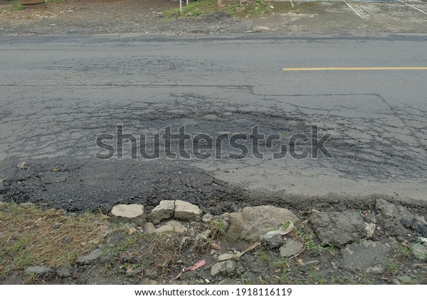 broken road bad
asphalt and conacred
road