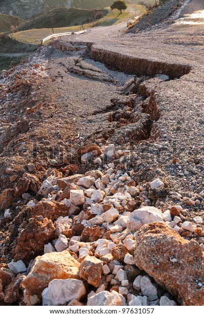 Broken\
road by an earthquake or landslide in\
countryside