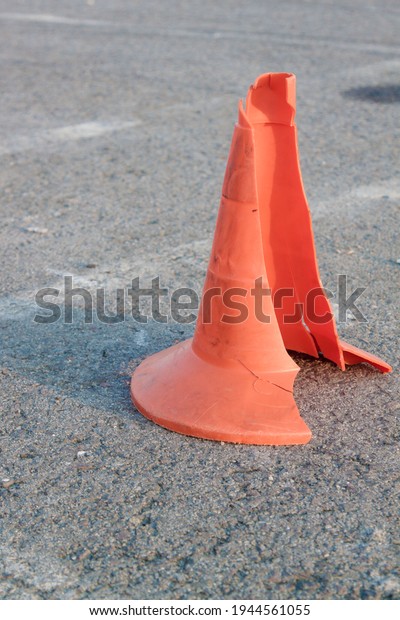broken road cone after a car\
crash