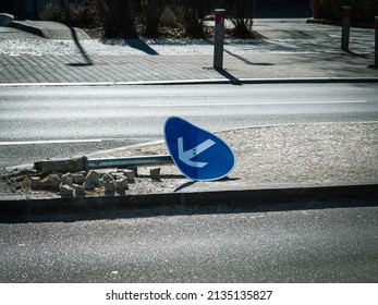 Broken road sign. road sign lies on the road