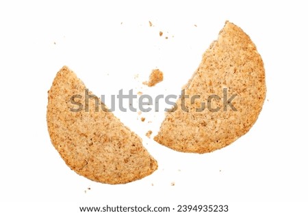 Broken round integral wholewheat biscuit with oatmeal isolated on white, top view, clipping path
