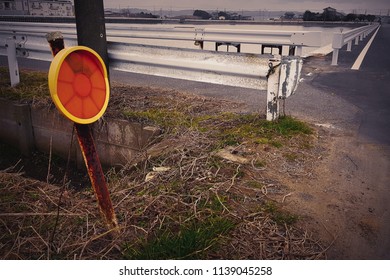 The broken rusty traffic-safety convex mirror that standing near the little street in Japan rural downtown, with vintage sepia color effect. - Powered by Shutterstock