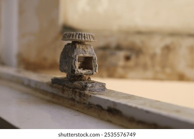 broken and rusty window stopper