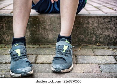 Broken shoes of a child as a symbolic image on the subject of child poverty