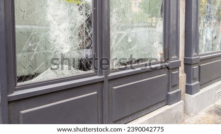 broken shop windows facade in town center smashed during protesters symbolizing the latest riots in city Foto stock © 