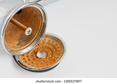 Broken Shower Head With Limescale And Rust On It