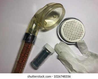 Broken Shower Head With Resin Putty And Gloves