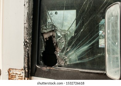 Broken Side Glass Of Armored Bank Truck Closeup