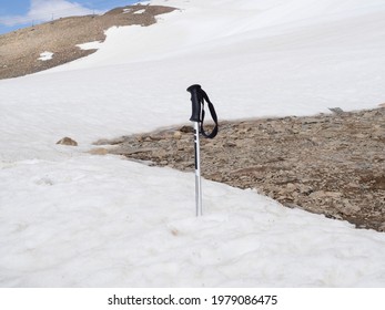 A Broken Ski Pole Stands In The Snow Against The Snow-capped Mountains Of Elbrus. Ski Sports Resort. The Concept Of Injury, Damage, Missing While Climbing. Rescue And Search In The Mountain.