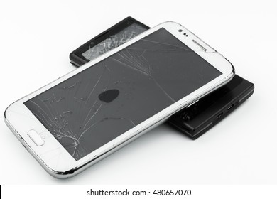 Broken smart phone on white background 
