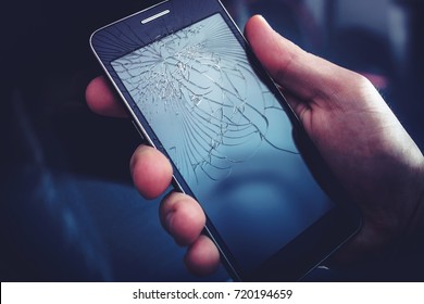 Broken Smartphone Display. Crashed Cellphone In Hand.