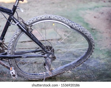 Broken Spoke And Damage Crooked Bicycle Wheel From Crash On The Ground Background