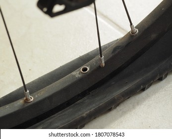 Broken Spoke On The Rim Of A Mountain Bike.