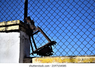 Broken Street Lamp On A Wall