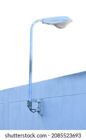 Broken Street Light Stuck On A Wall Against White Background.