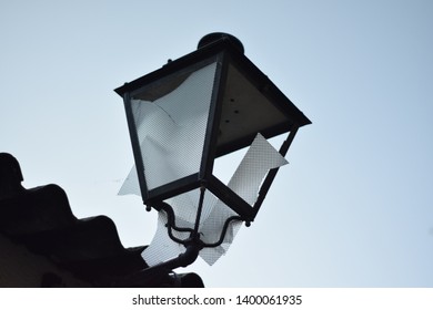 A Broken Streetlight In A Town In Madrid