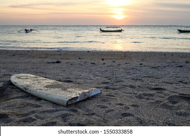 Broken Surfboard At The Beach