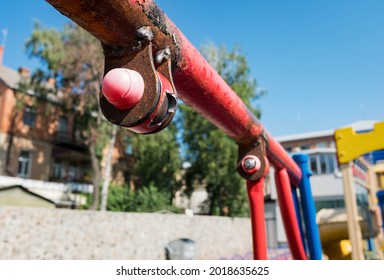 Broken Swing On Playground Due To Torn Of Metal And Weld