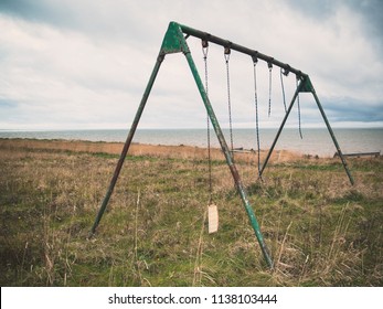 Broken Swingset On An Abandoned Playground