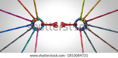Broken team and divided Industry partnership and divided teamwork concept as a small business metaphor for breaking apart a big team as diverse ropes connected as a corporate symbol.