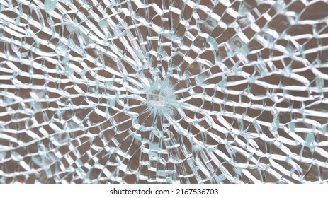 Broken Tempered Glass Abstract Background Texture, Shattered Glass Window Object Structure, Bullet Hole Macro Detail Extreme Closeup, Nobody. Damaged Cracked Glass Pane Panel Simple Concept, No People