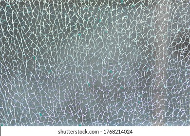 Broken tempered glass. Cracked glass web. - Shutterstock ID 1768214024