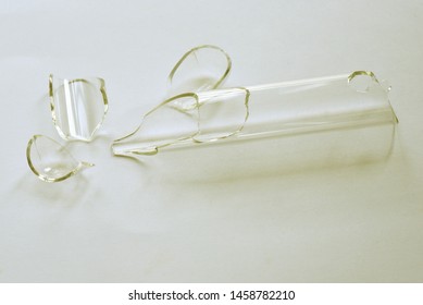 A broken test tube on white background.