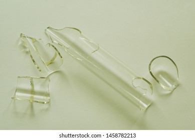 A Broken Test Tube On White Background.