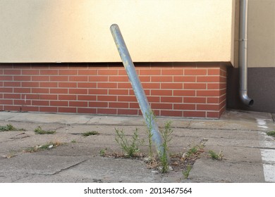 Broken, Tilted Parking Bollard, Metal