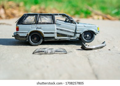 Broken Toy Car  Into Pieces, Wheels And Glass 