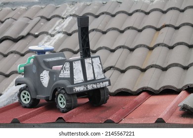 Broken Toy Car On The Roof