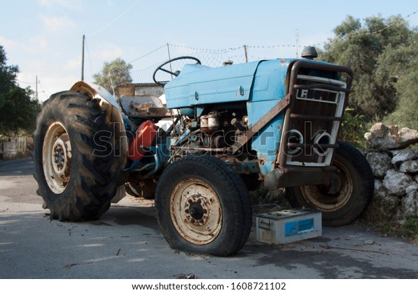 Broken tractor on a road\
