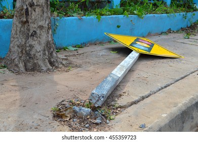 Broken Traffic Light Sign On Footpath Of The Road