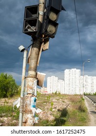 Broken Traffic Lights On The Post Near The Road.