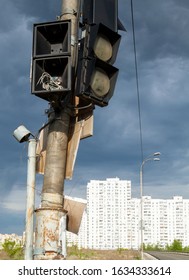 Broken Traffic Lights On The Post Near The Road.