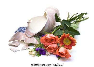 A Broken Vase And Some Flowers On White Background