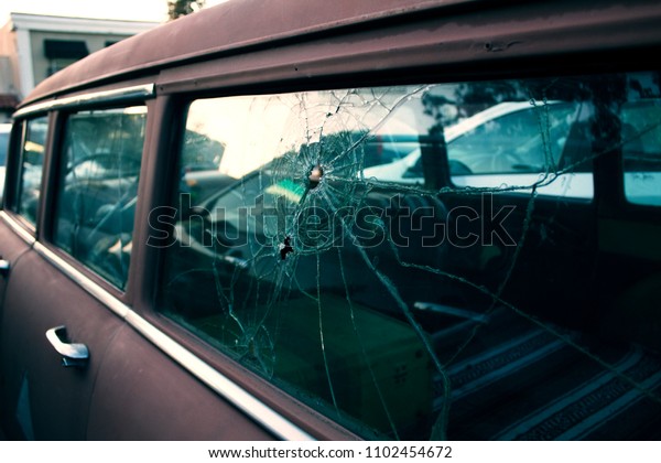 Broken Vintage Car\
Window from Bullet Hole