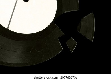 Broken Vinyl Record Music Closeup Background. Pieces Of Vinyl Isolate. Nostalgia Music Pattern. Old Vinyl Plate. Melancholy Vintage Stylized Photo.