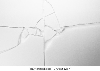 Broken white ground texture background. Cracks in the ground.