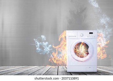 Broken White Washing Machine With Smoke And Fire