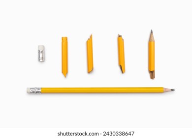 Broken and whole pencil on a white horizontal background. Two yellow graphite pencils broken into many parts and whole close-up. Emotions, stress, anger, aggression, studies, work - Powered by Shutterstock