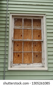 Broken Window, Boarded Up From The Inside. 