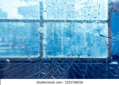 broken window in frame. on the background of the city and street. texture, background