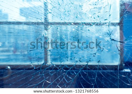 broken window in frame. on the background of the city and street. texture, background