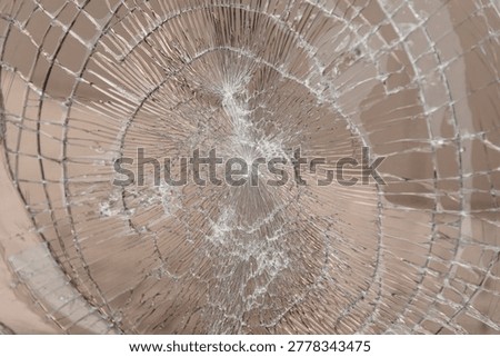 broken window glass, abstract pattern, divergent lines, hooliganism and damage to property