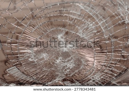 broken window glass, abstract pattern, divergent lines, hooliganism and damage to property