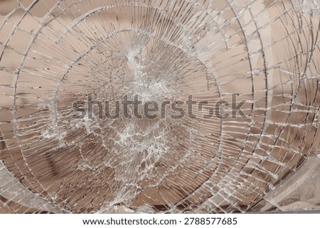 broken window glass, abstract pattern, divergent lines, hooliganism and damage to property