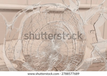 broken window glass, abstract pattern, divergent lines, hooliganism and damage to property