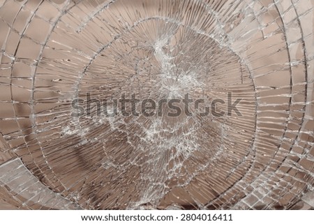 broken window glass, abstract pattern, divergent lines, hooliganism and damage to property