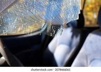broken window glass at the front seat of a car